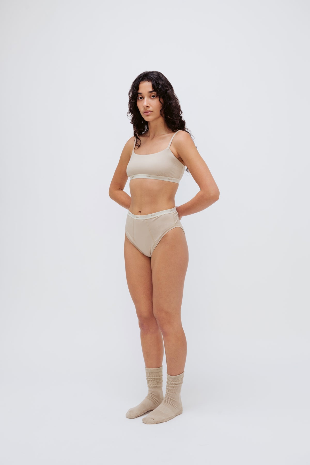 Square Neck Bralette in latte silky-soft micromodal blend worn with women's latte high waisted briefs by female model, front view