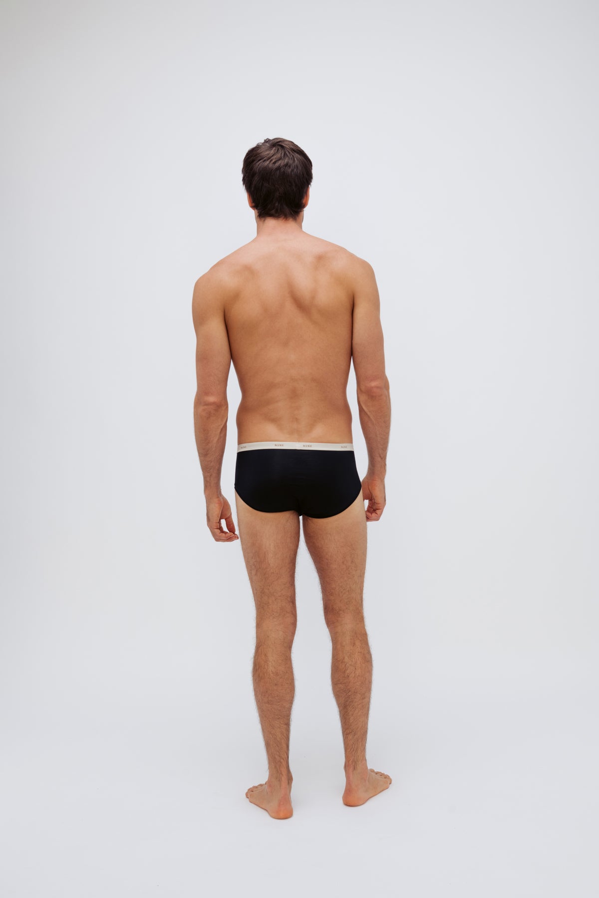 Men's Black Original Briefs crafted from premium micro modal worn by male model back view