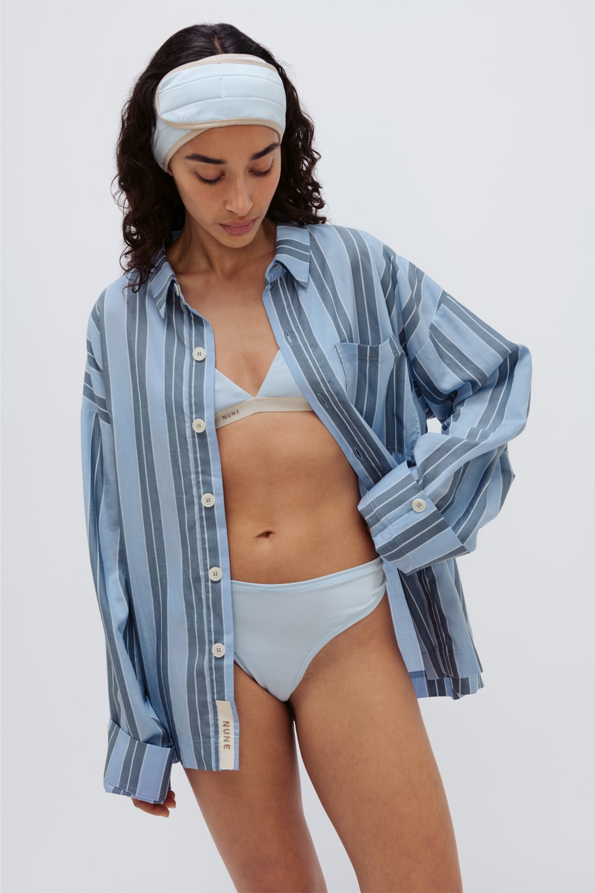 Blue Daybreak Stripe Long Sleeve Sleep Shirt in Macel worn by model over daybreak triangle bralette and mid brief. Model also wearing blue micromodal blend headband