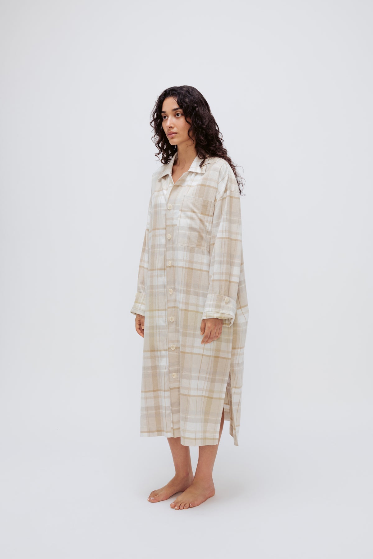Oat Check House Shirt worn by female model, standing side view showing adjustable sleeve length