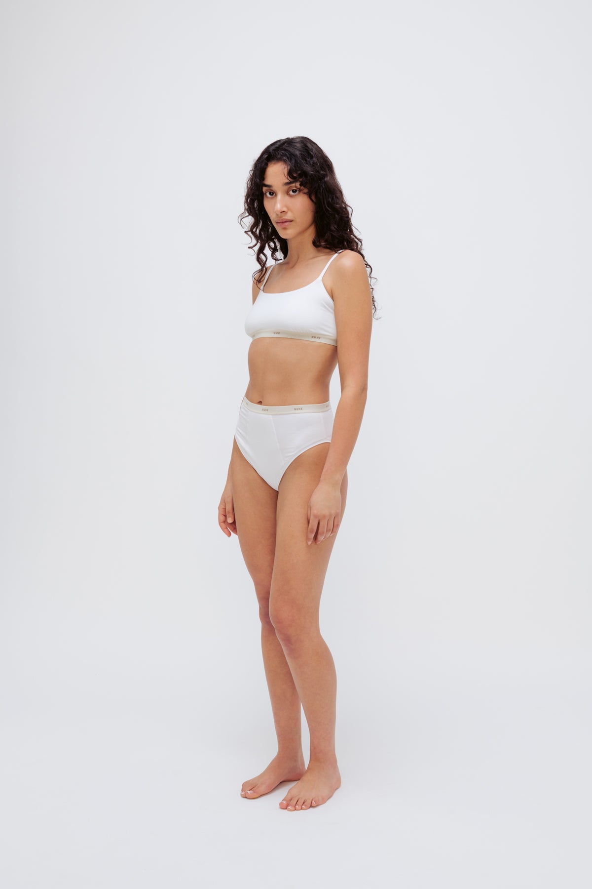 Square Neck Bralette in white silky-soft micromodal blend worn with women's white high waisted briefs by female model, front view