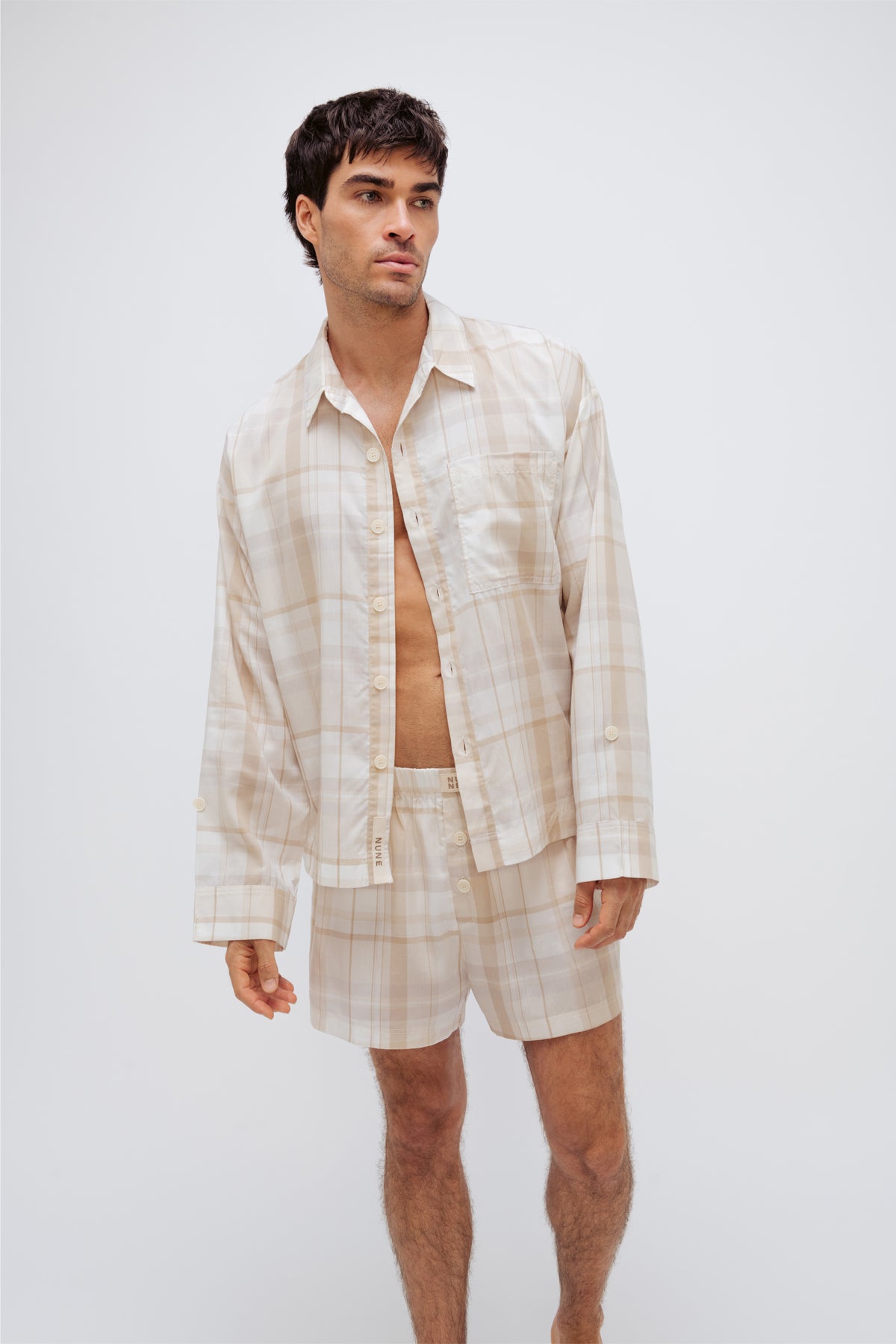Oat check boxer shorts and sleep shirt worn by male model