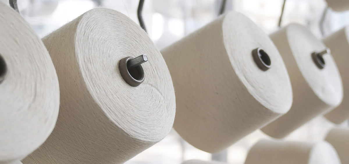 Close up of reels of natural cotton thread