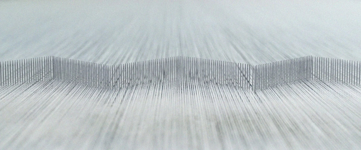 Close-up of a fabric texture with a neutral color palette