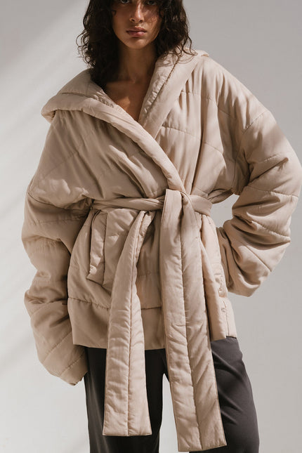 Short Doona Robe Oat worn by female model over Charcoal Cosy Pant, front view showing removable waist tie of robe