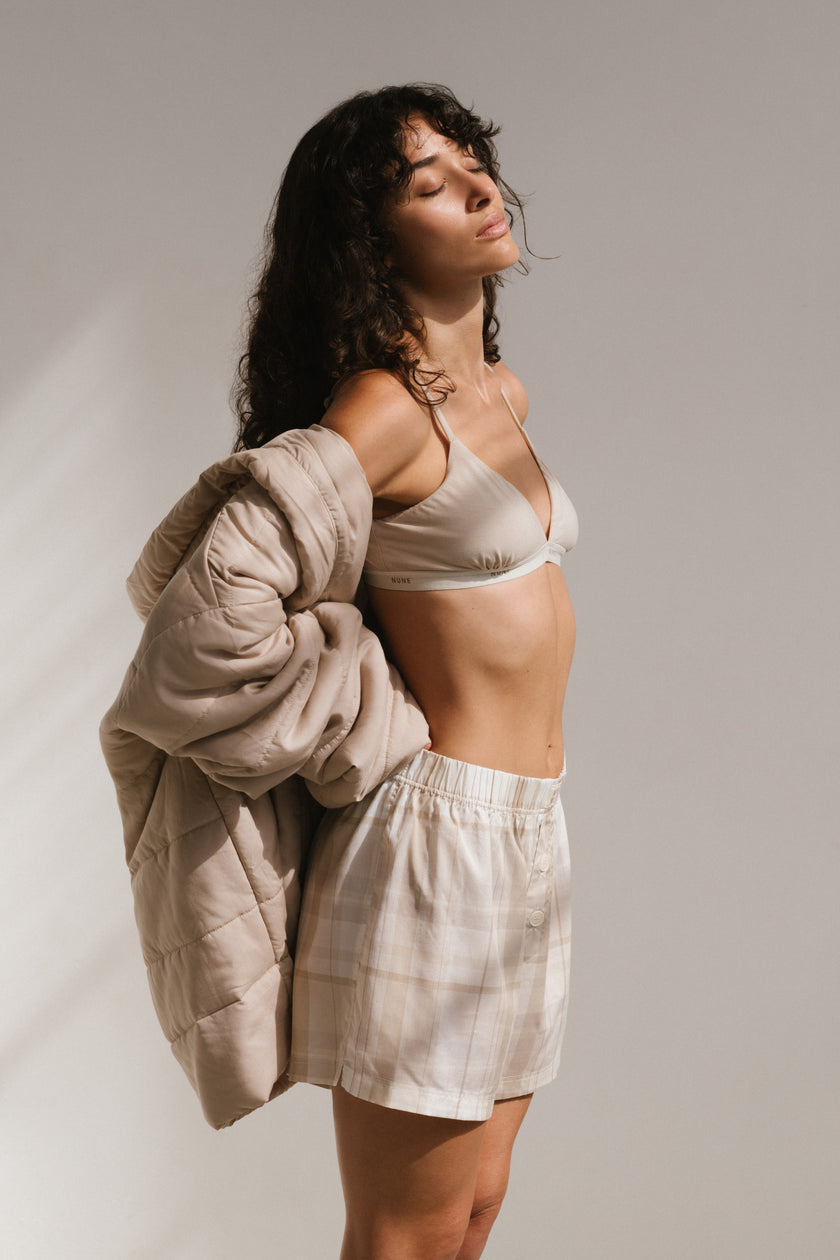 Triangle Bralette in Latte and Oat Boxer Shorts worn by female model, with Oat Short Donna Robe worn off the shoulders