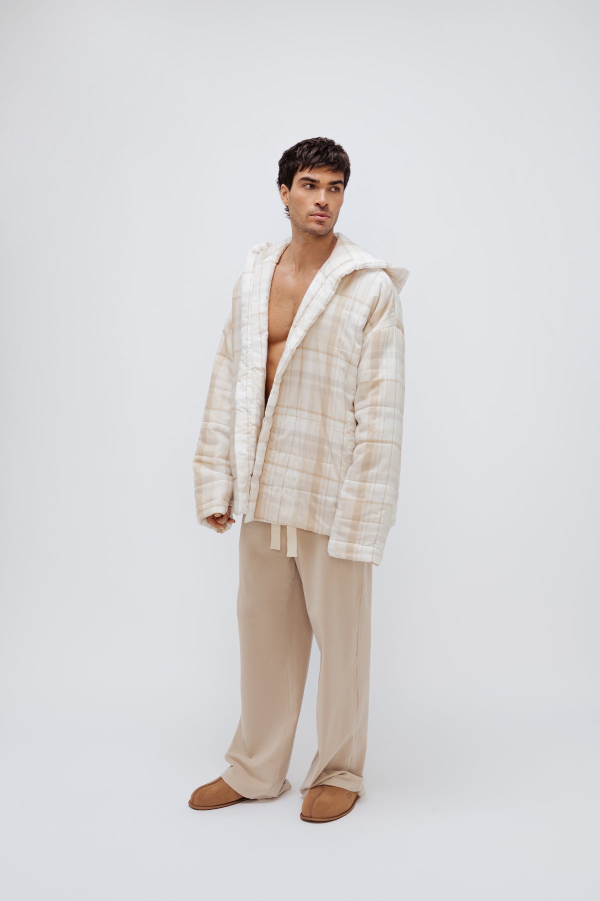 Oat Check Short Doona Robe and Cosy Pant in Oat worn by male model standing front side view 