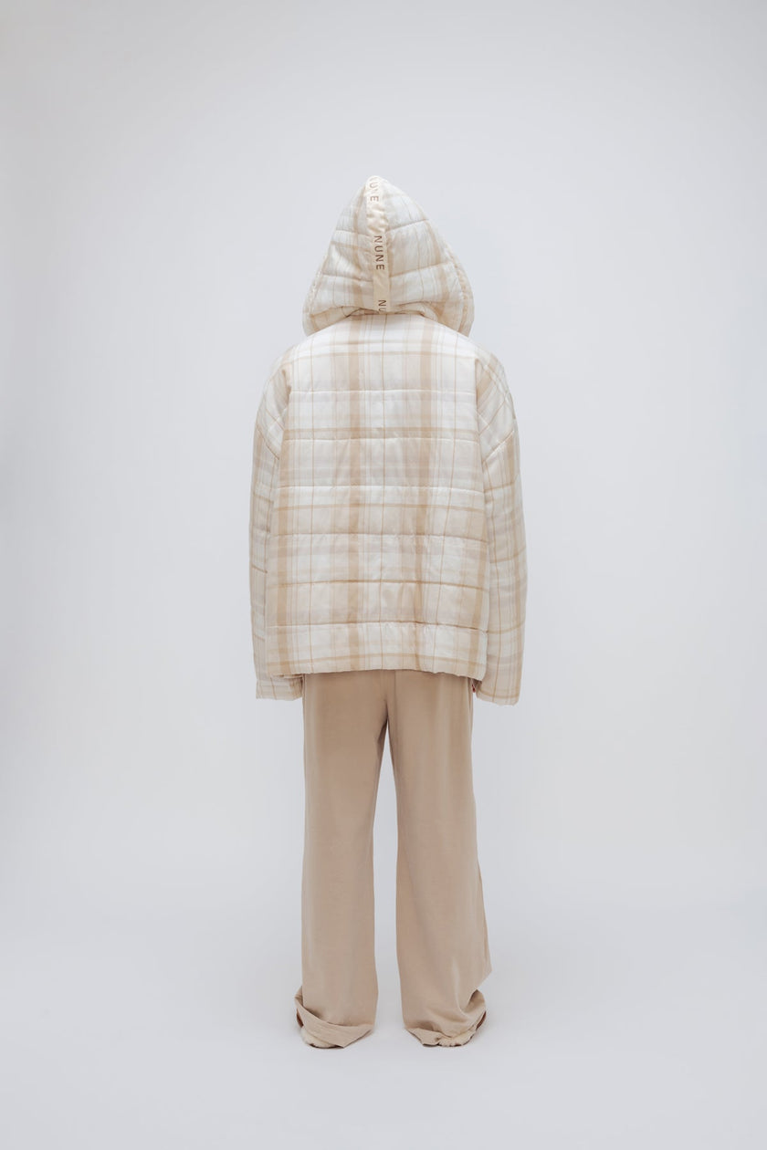 Oat Check Short Doona Robe and Cosy Pant in Oat worn by male model standing back view with hood up over his head