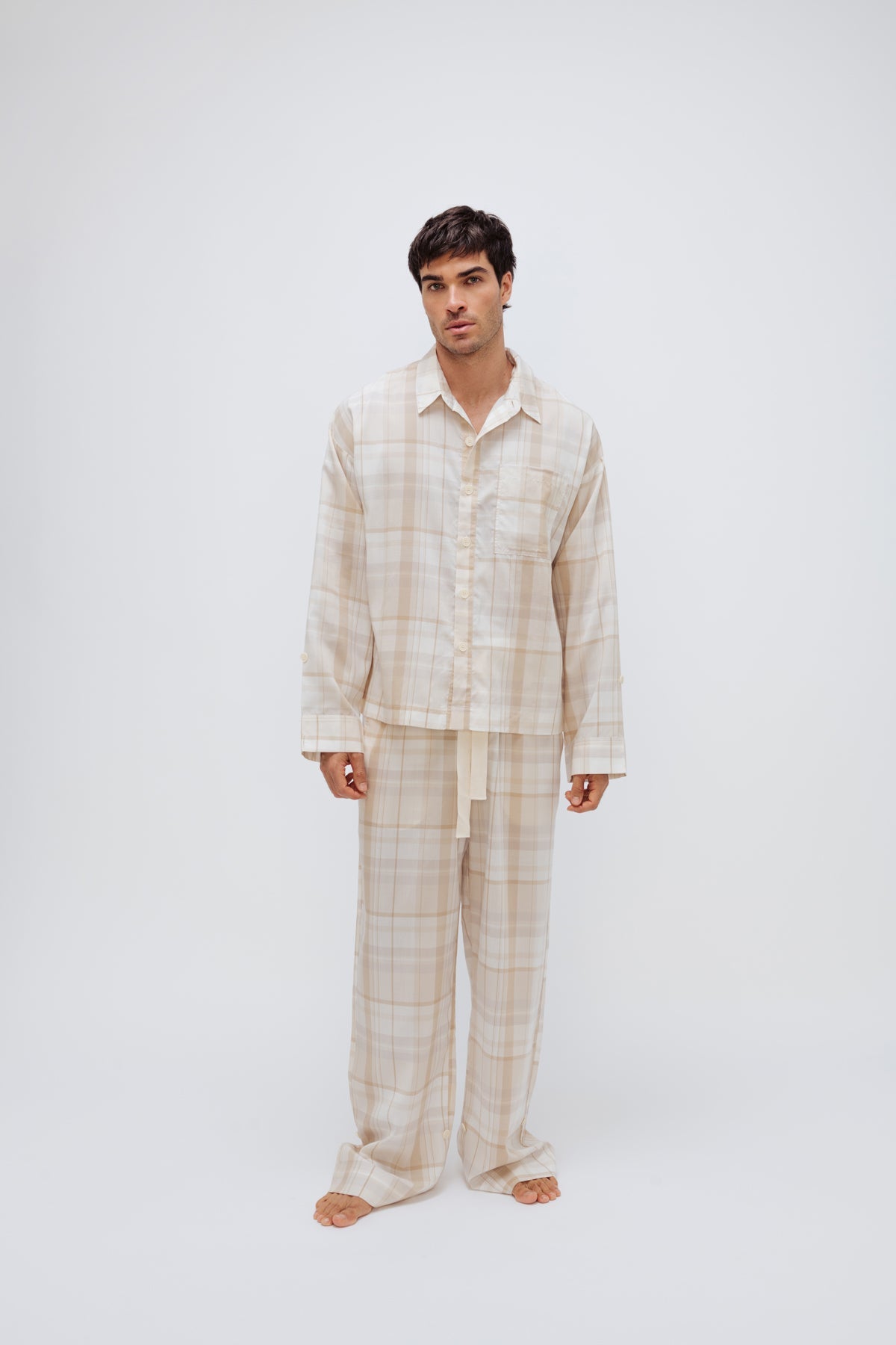 Oat Check Long Sleeve Sleep Shirt and Long Sleep Pant Macel worn by male model, front view showing buttons and front pocket on shirt and natural cotton waist tie on pants
