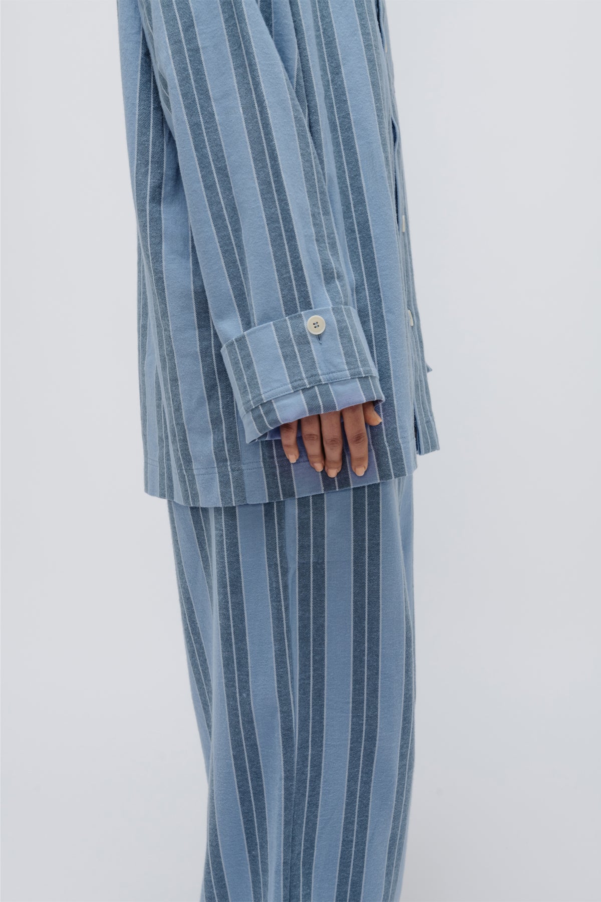 Close up of button-up cuff feature on Blue Daybreak Stripe Flannel Long Sleeve Sleep Shirt and Pants 