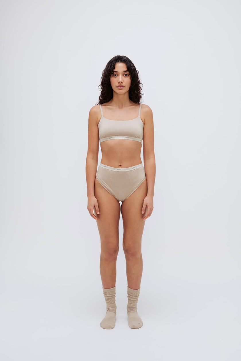 Square Neck Bralette in latte silky-soft micromodal blend worn with women's latte high waisted briefs by female model, front view
