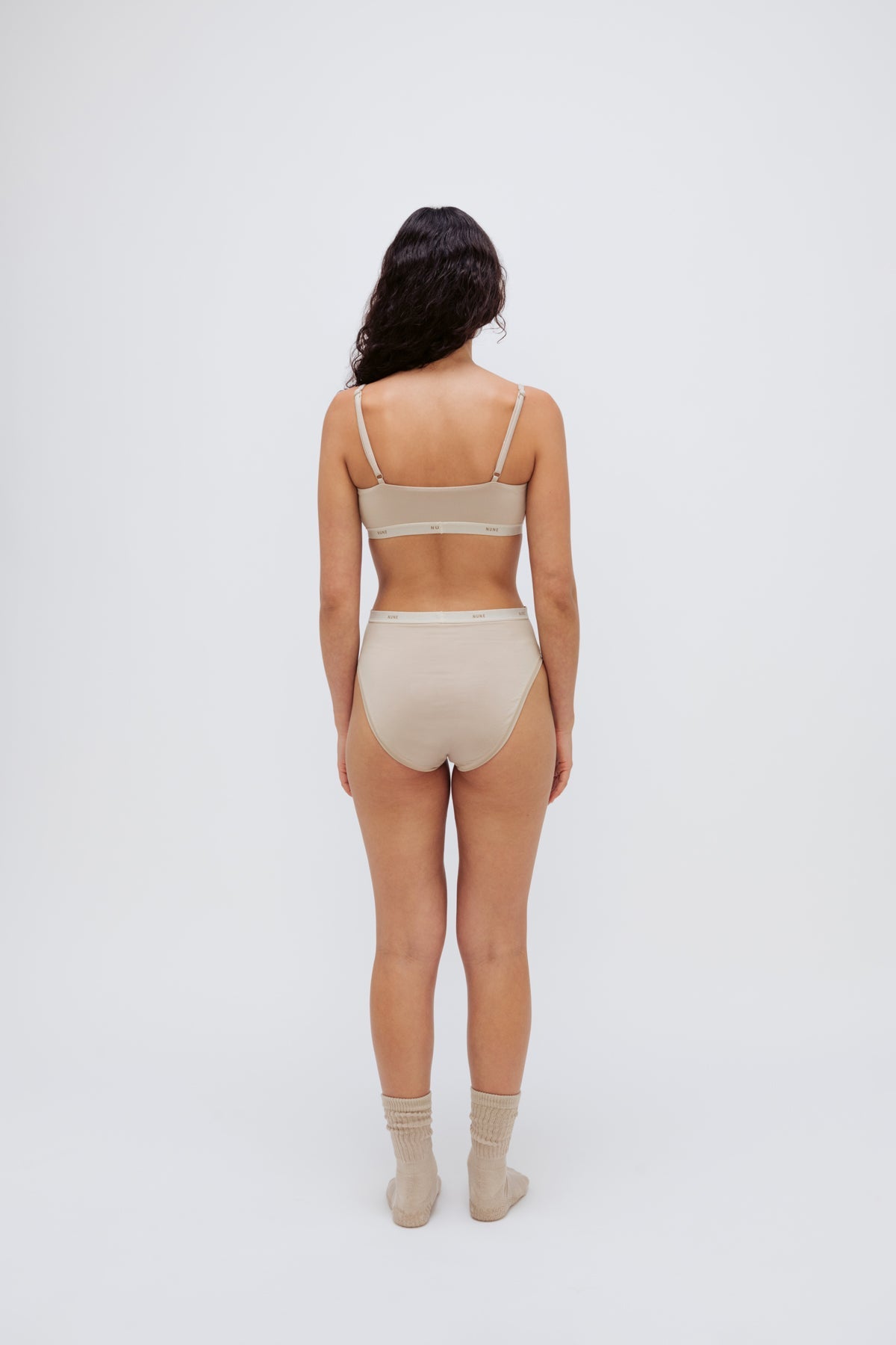 Square Neck Bralette in latte silky-soft micromodal blend worn with women's latte high waisted briefs by female model, back view