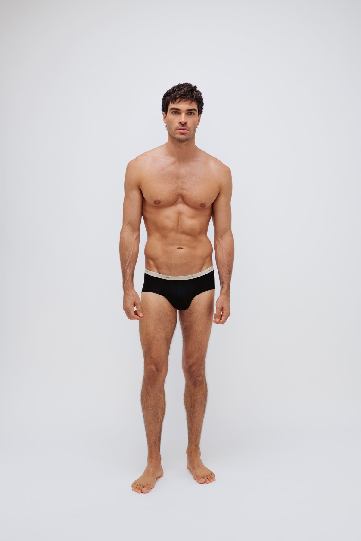 Men's Black Original Briefs crafted from premium micro modal worn by male model front view