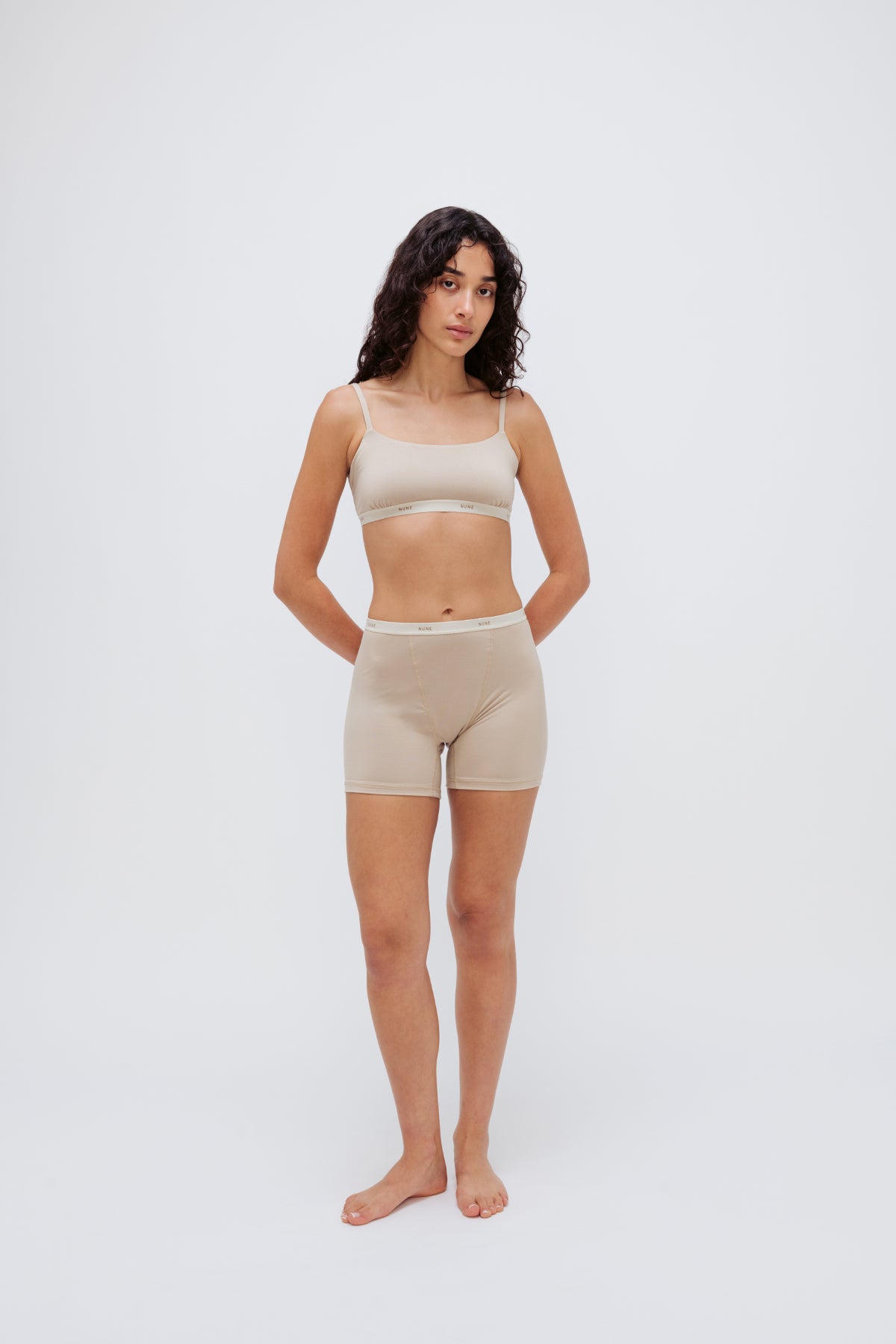 Women’s Boxer Brief in Latte silky-soft micromodal blend, like his Boxer Briefs, only cooler, and Square Neck Bralette in Latte worn by female model, front view