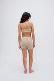 Women’s Boxer Brief in Latte silky-soft micromodal blend, like his Boxer Briefs, only cooler, and Square Neck Bralette in Latte worn by female model, back view