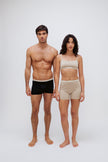 Women’s Boxer Brief in Latte silky-soft micromodal blend and Square Neck Bralette in Latte worn by female model and Black Original Boxer Briefs worn by male model, front view