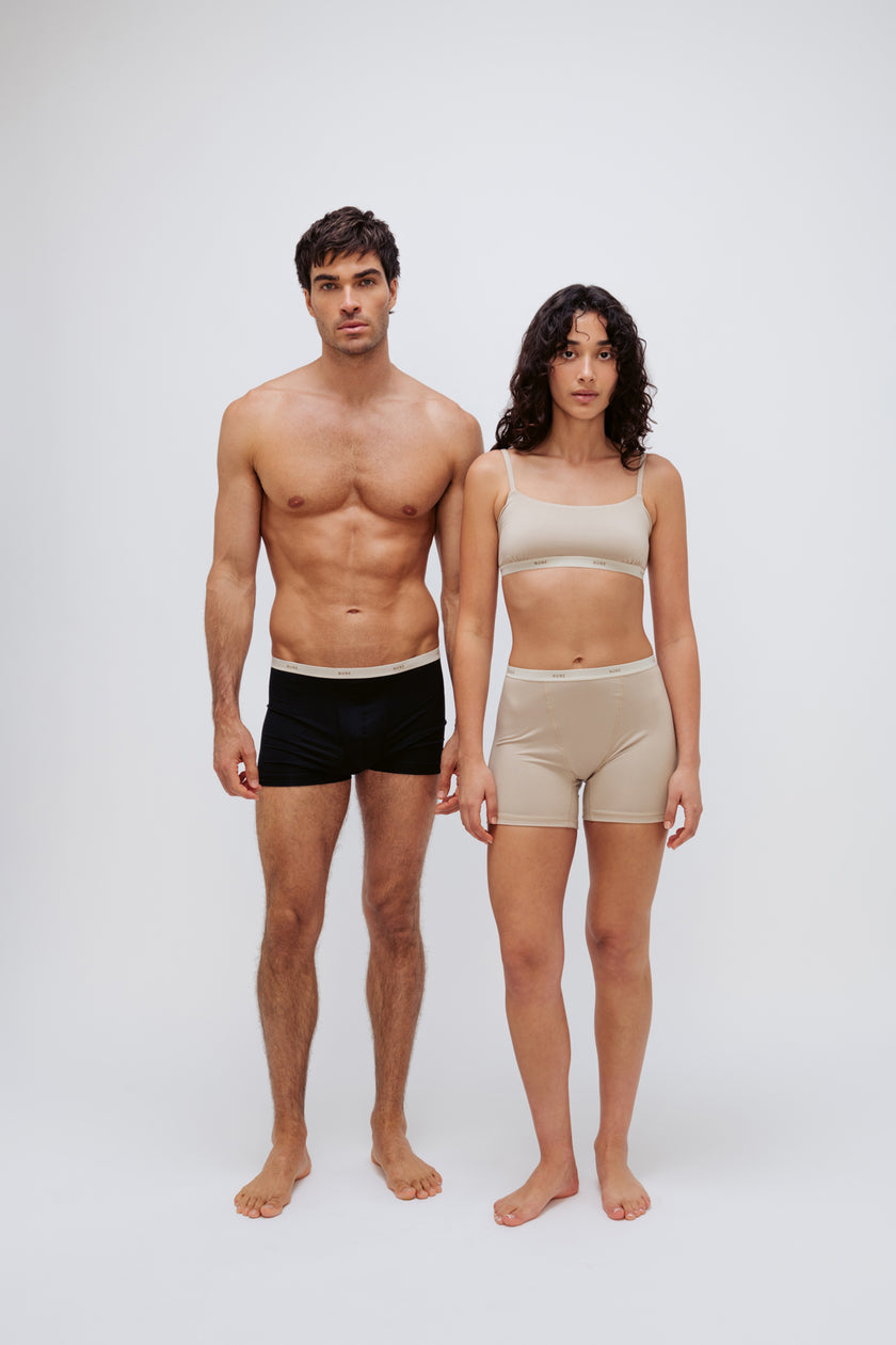 Women’s Boxer Brief in Latte silky-soft micromodal blend and Square Neck Bralette in Latte worn by female model and Black Original Boxer Briefs worn by male model, front view