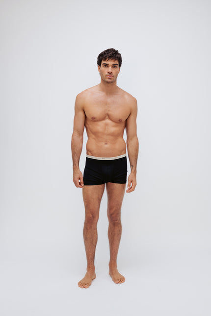 Men's black original briefs worn by model full front view
