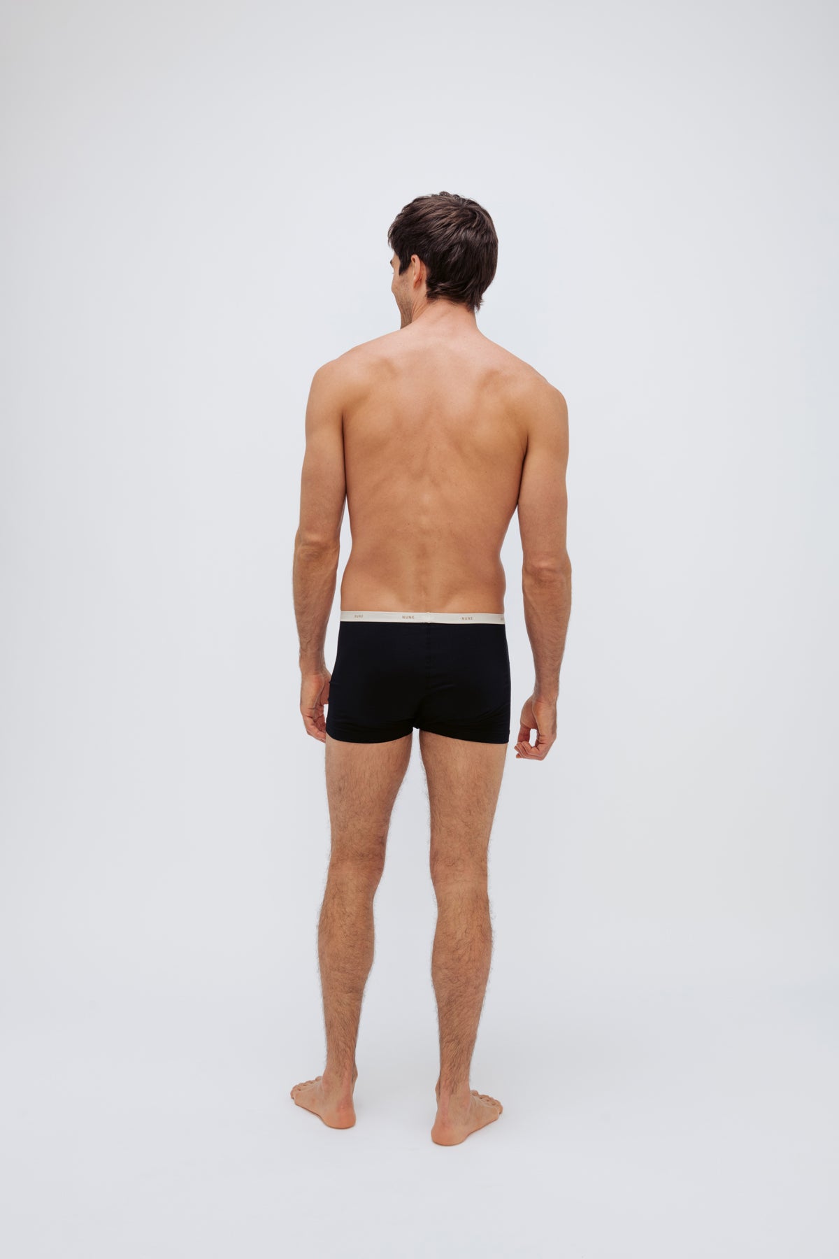 Men's Black Original Briefs crafted from premium micro modal worn by male model back view