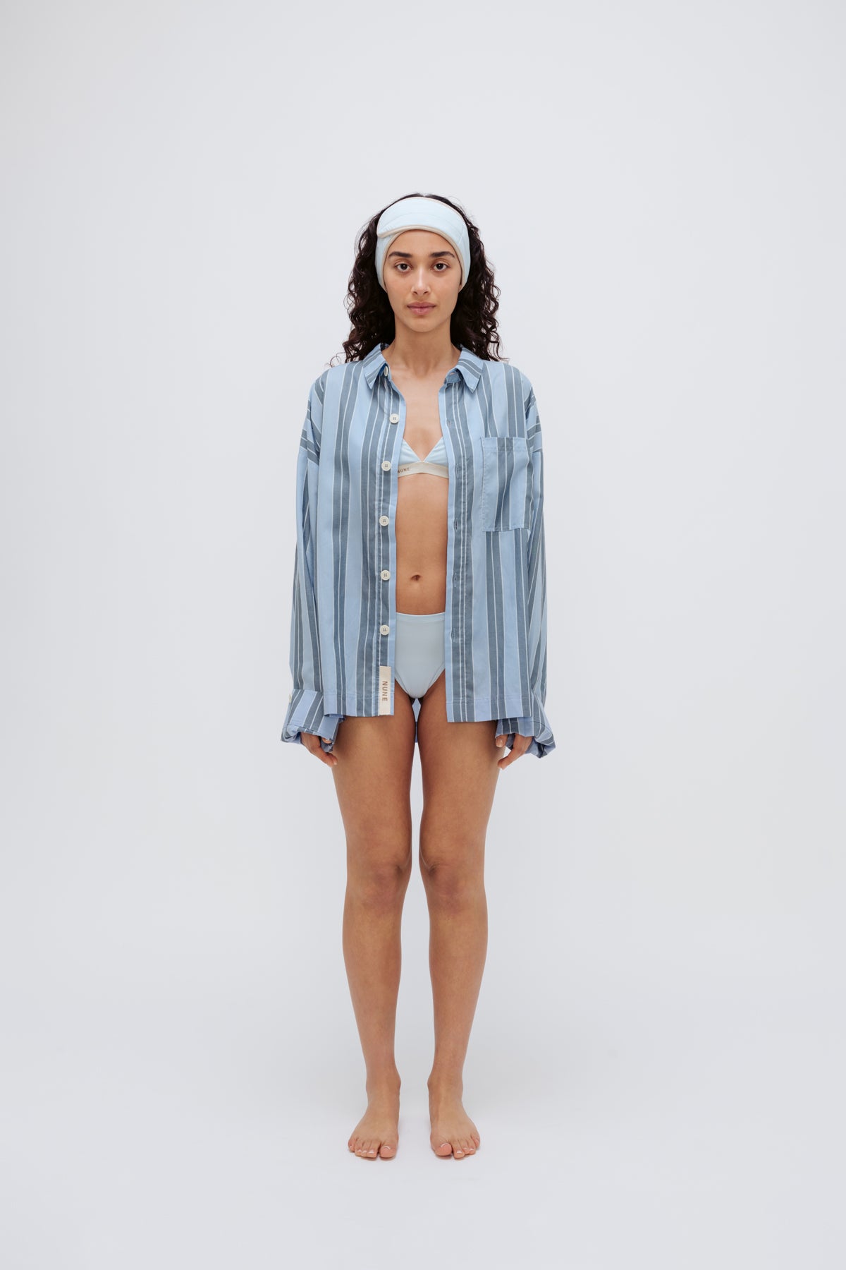 Blue Daybreak Stripe Long Sleeve Sleep Shirt in Macel worn by model over daybreak triangle bralette and mid brief.  Model also wearing blue micromodal blend headband