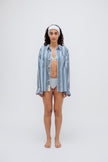 Blue Daybreak Stripe Long Sleeve Sleep Shirt in Macel worn by model over daybreak triangle bralette and mid brief.  Model also wearing blue micromodal blend headband