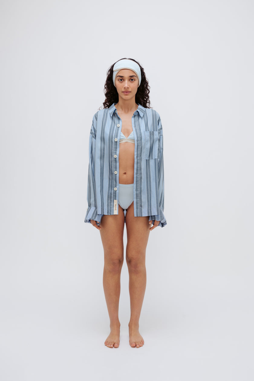 Blue Daybreak Stripe Long Sleeve Sleep Shirt in Macel worn by model over daybreak triangle bralette and mid brief.  Model also wearing blue micromodal blend headband