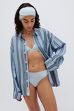 Long Sleeve Sleep Shirt in Daybreak Stripe Macel worn over Triangle Bralette and G String in daybreak silky-soft micromodal blend worn by female model, with daybreak padded, adjustable headband