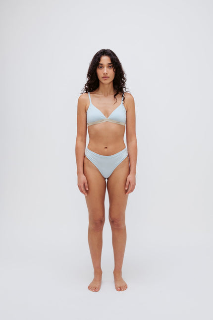 Triangle Bralette in daybreak silky-soft micromodal blend worn with women's daybreak g string by female model, front view