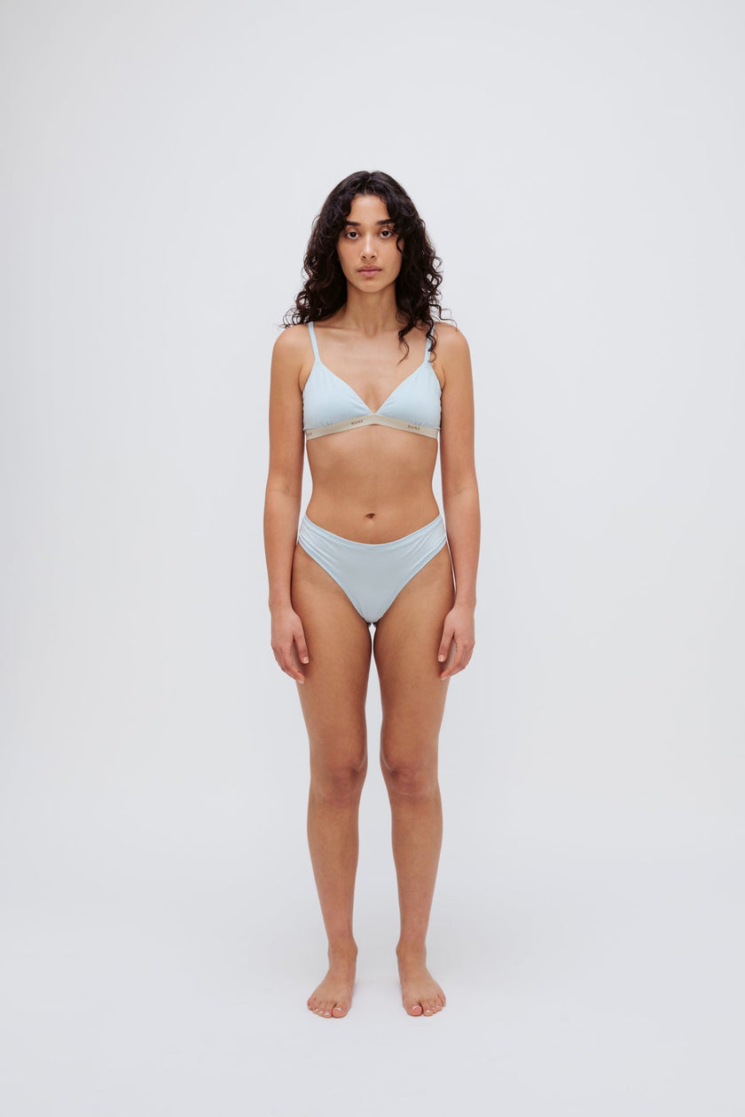Triangle Bralette in daybreak silky-soft micromodal blend worn with women's daybreak g string by female model, front view