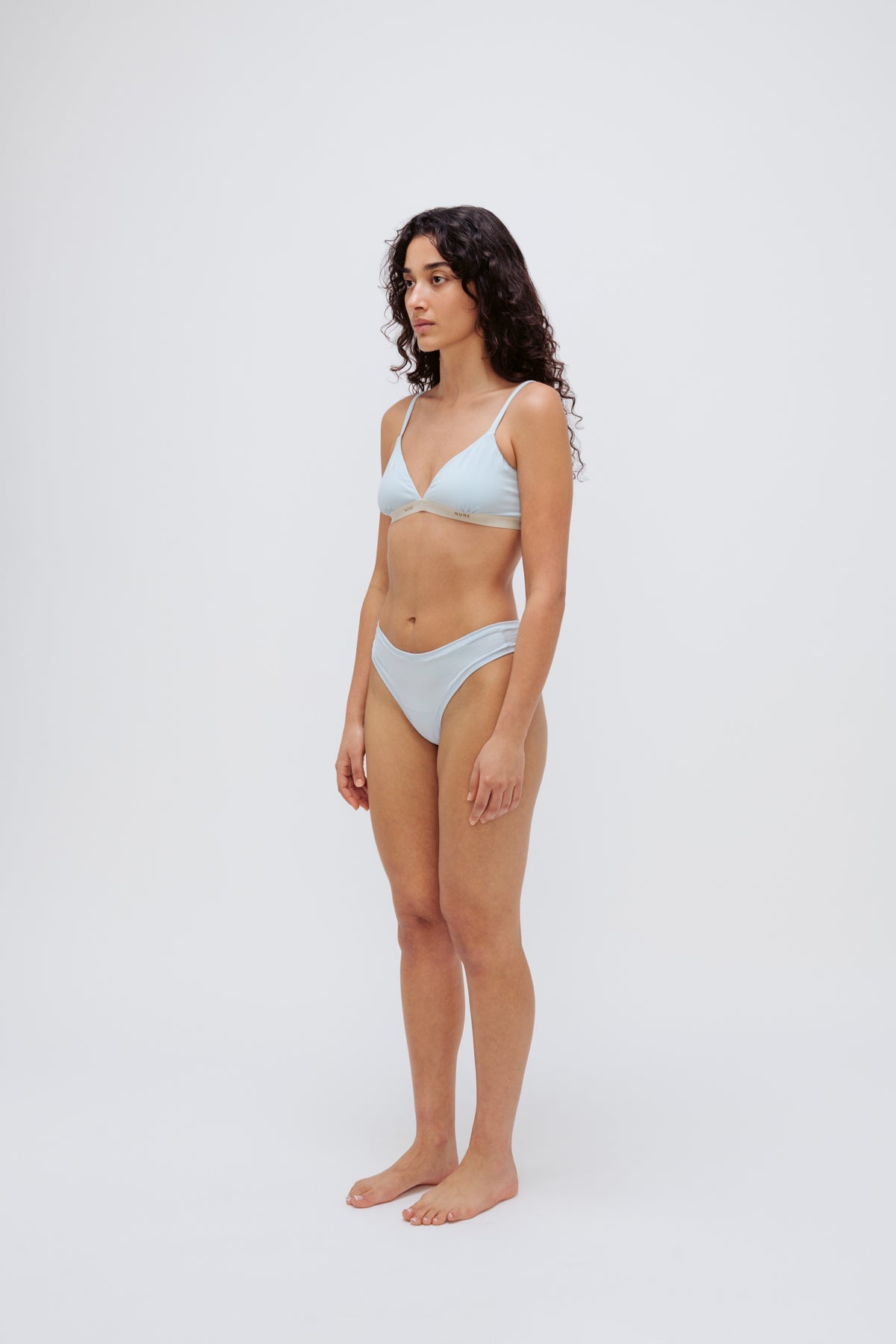 Triangle Bralette in daybreak silky-soft micromodal blend worn with women's daybreak g string by female model, front view