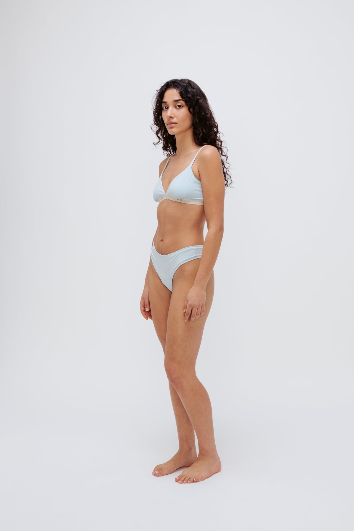 Triangle Bralette in daybreak silky-soft micromodal blend worn with women's daybreak g string by female model, front view