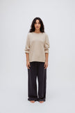 Cosy Long Sleeve Top in Latte and Cosy Pants in Charcoal worn by female model front view with sleeves rolled up on arms