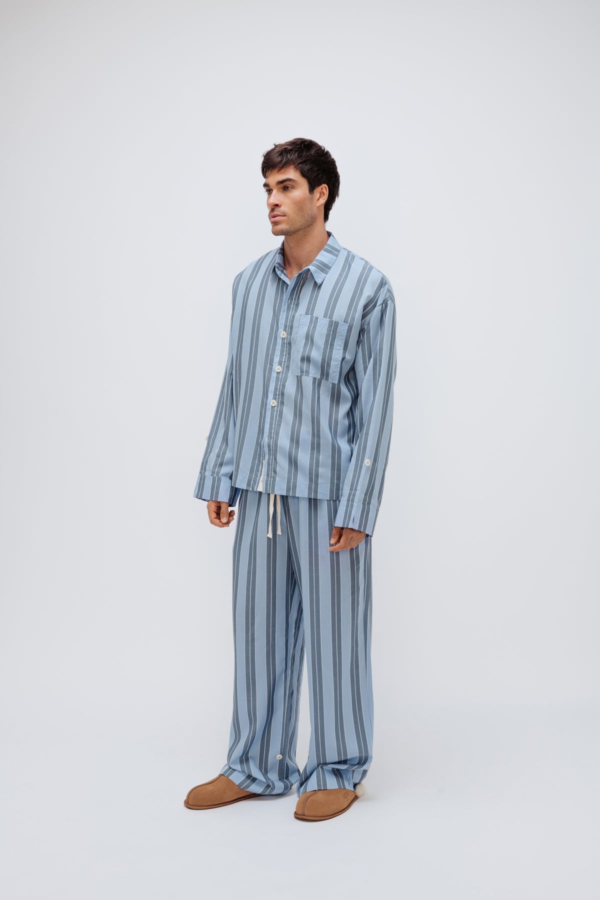 Blue Daybreak Stripe Long Sleeve Sleep Shirt and Pants in Macel worn by male model - facing off to the side