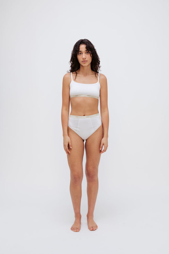 Square Neck Bralette in white silky-soft micromodal blend worn with women's white high waisted briefs by female model, front view