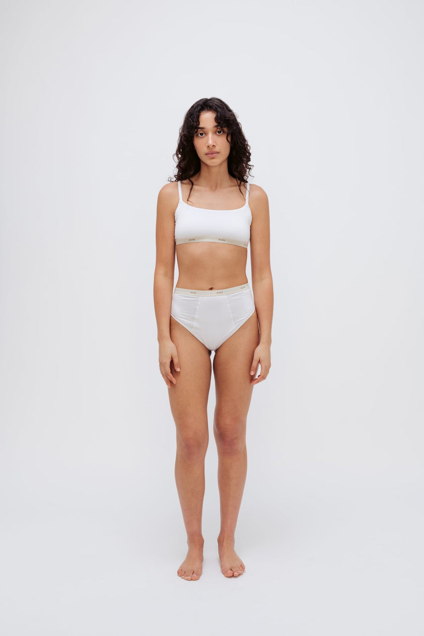 Square Neck Bralette in white silky-soft micromodal blend worn with women's white high waisted briefs by female model, front view