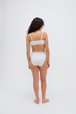 Square Neck Bralette in white silky-soft micromodal blend worn with women's white high waisted briefs by female model, back view