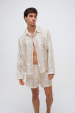Oat check boxer shorts and sleep shirt worn by male model