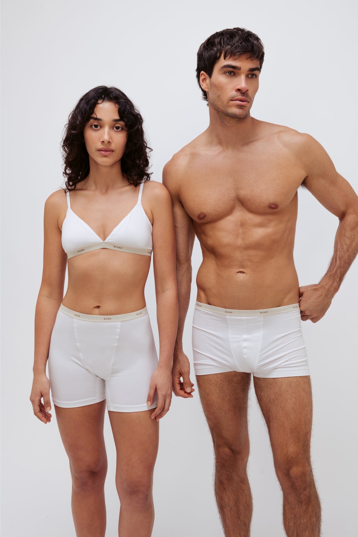 Women’s Boxer Brief in White silky-soft micromodal blend worn with White Triangle Bralette worn by female model and White Original Boxer Briefs worn by male model, front view