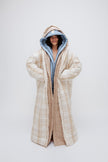 Long Doona Robes in Daybreak Stripe, Oat and Oat Check worn layered by female model smiling, full length view showing super long length of robes