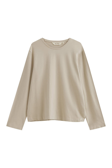 The Cosy Long Sleeve Top in latte front view showing a soft collar band for subtle structure.