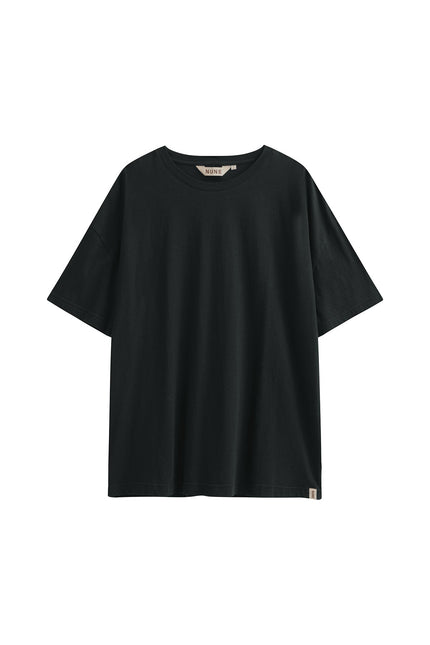 Black Oversized Tee with a drop-shoulder silhouette made in organic cotton jersey, front view