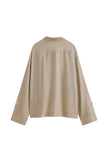 Lightweight and breathable, this oat long sleeve sleep shirt offers year-round comfort. Shirt back view.