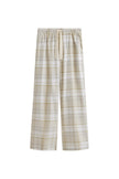 The flannel sleep pant in Oat Check. Adjustable length, a natural waist tie, and functional pockets make it a practical sleepwear essential.  Front view showing natural cotton waist tie and front pockets.