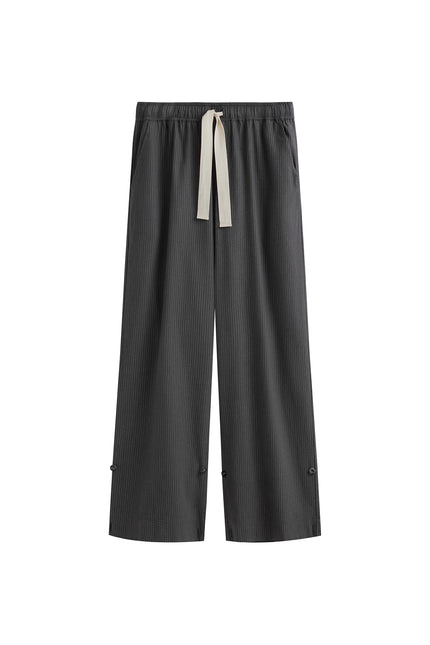 The flannel sleep pant in Evening Pinstripe. Front view showing natural cotton waist tie and front pockets.