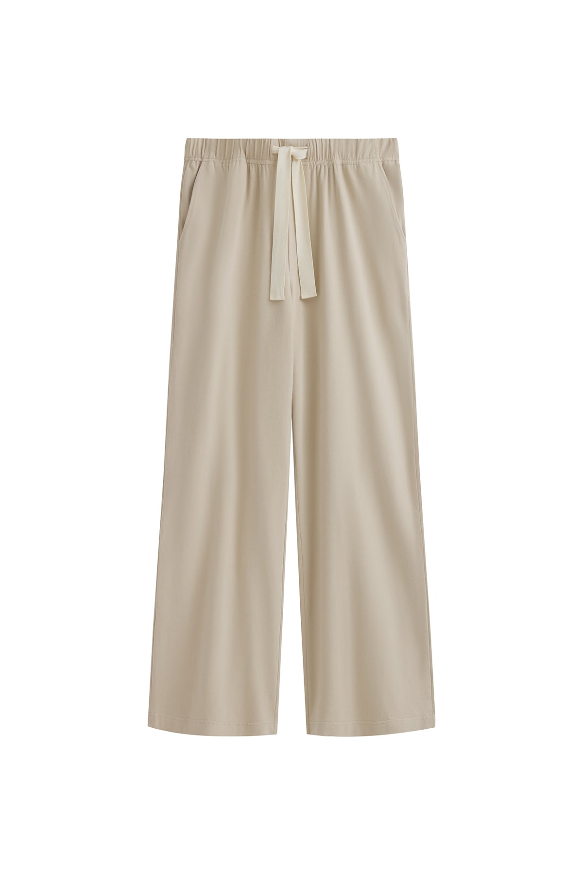 The Cosy Pant in Latte offers a refined alternative to traditional track pants. Front view showing front pockets and natural cotton waist tie.