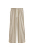 The Cosy Pant in Latte offers a refined alternative to traditional track pants. Front view showing front pockets and natural cotton waist tie.