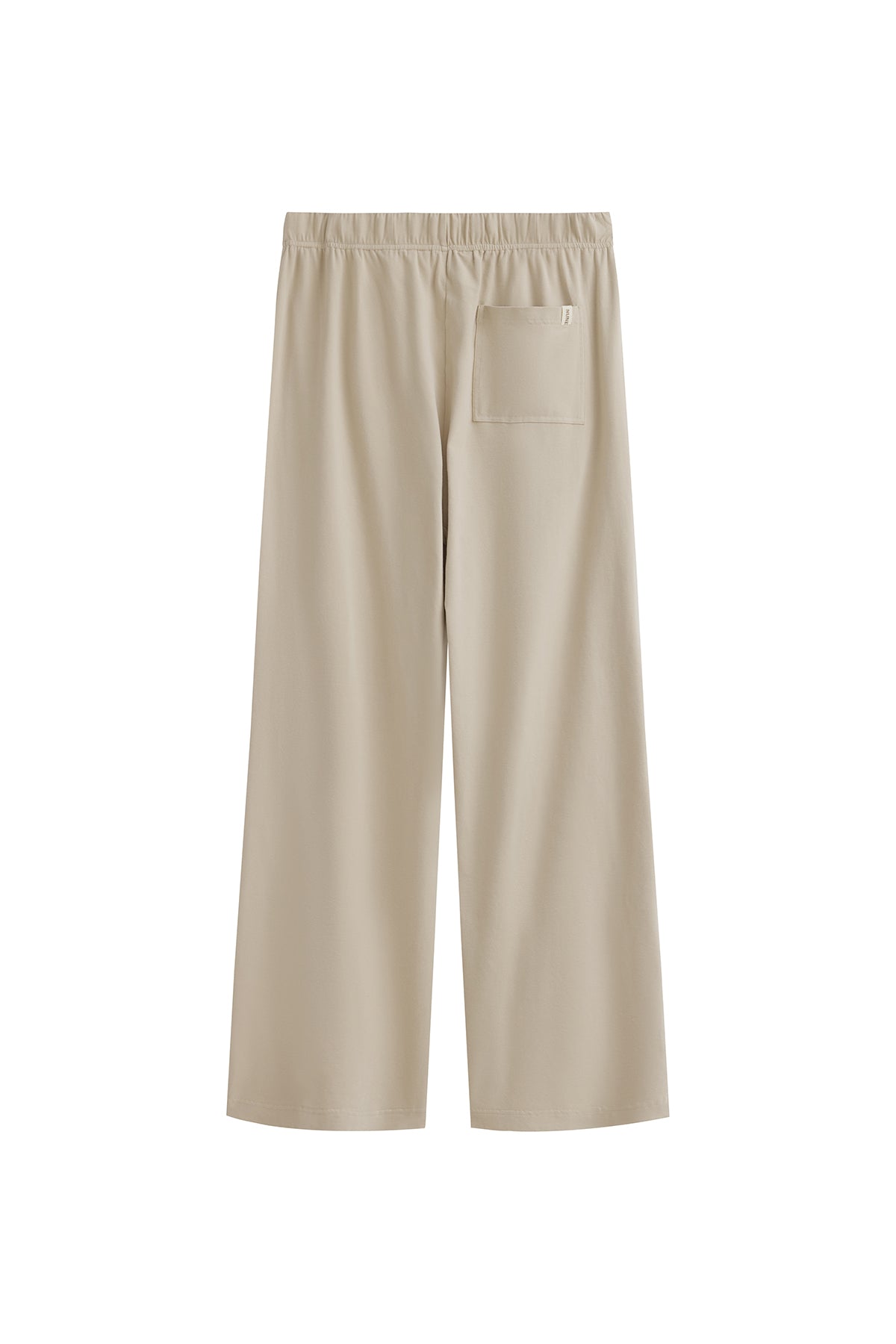 The Cosy Pant in Latte offers a refined alternative to traditional track pants. Back view showing single back pocket and elastic waist.