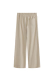 The Cosy Pant in Latte offers a refined alternative to traditional track pants. Back view showing single back pocket and elastic waist.