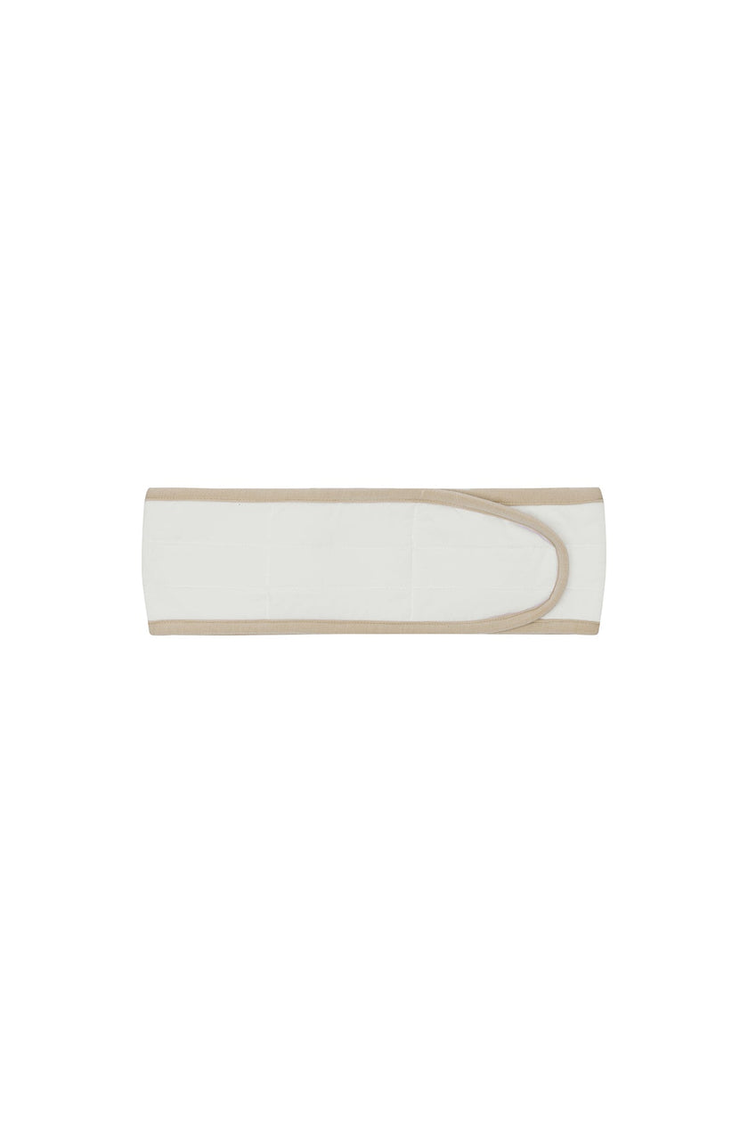 White padded, adjustable headband with latte bind edge and velcro adjustable closure